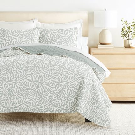 Elegant leaf-patterned bedding set on modern bed