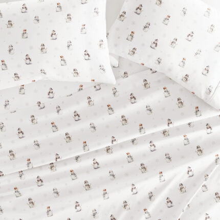 Snowman pattern bedding set on white background.